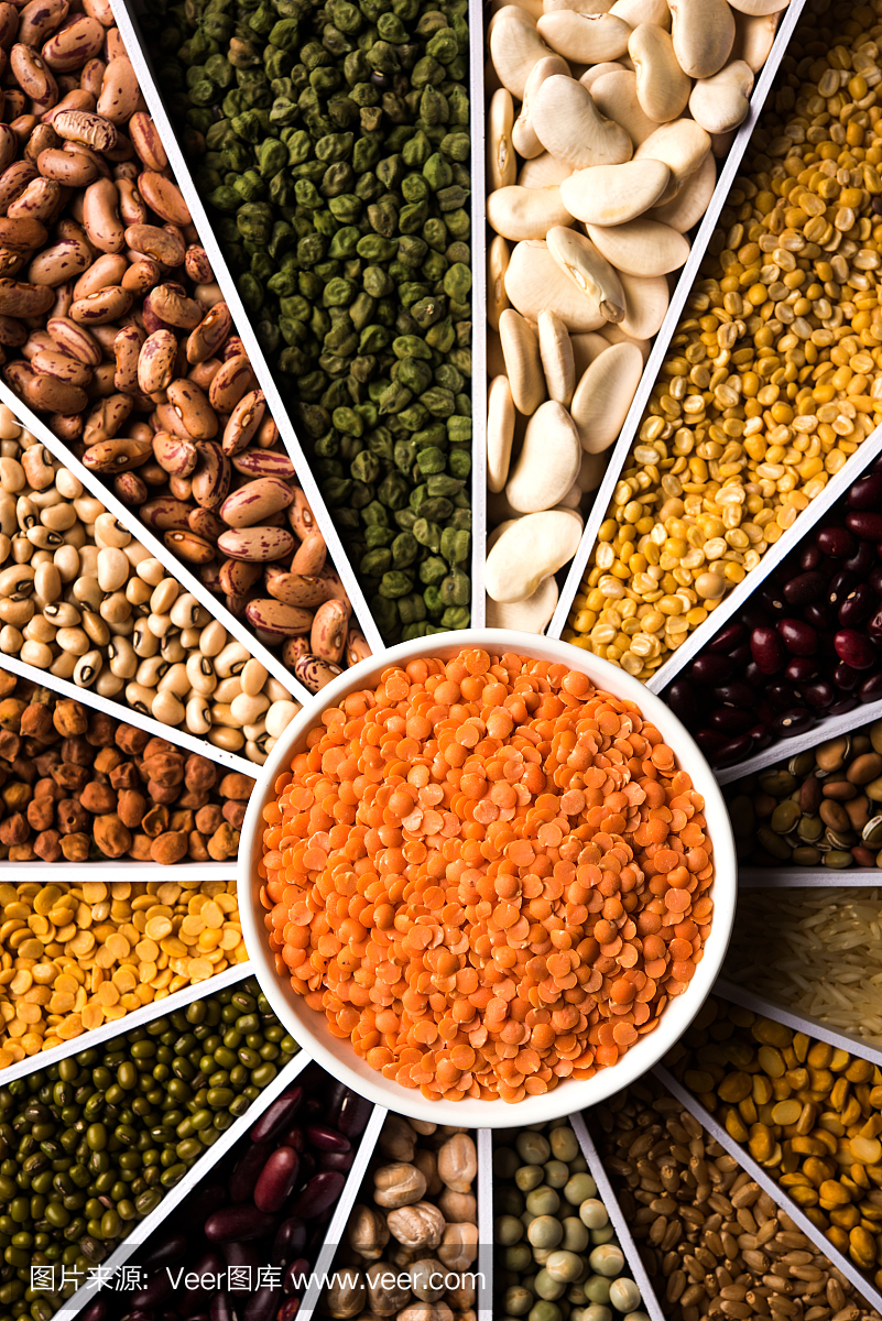 印度豆,豆类,扁豆,大米和小麦谷物在一个白色的Sunburst或阳光形状设计容器,选择性的焦点。